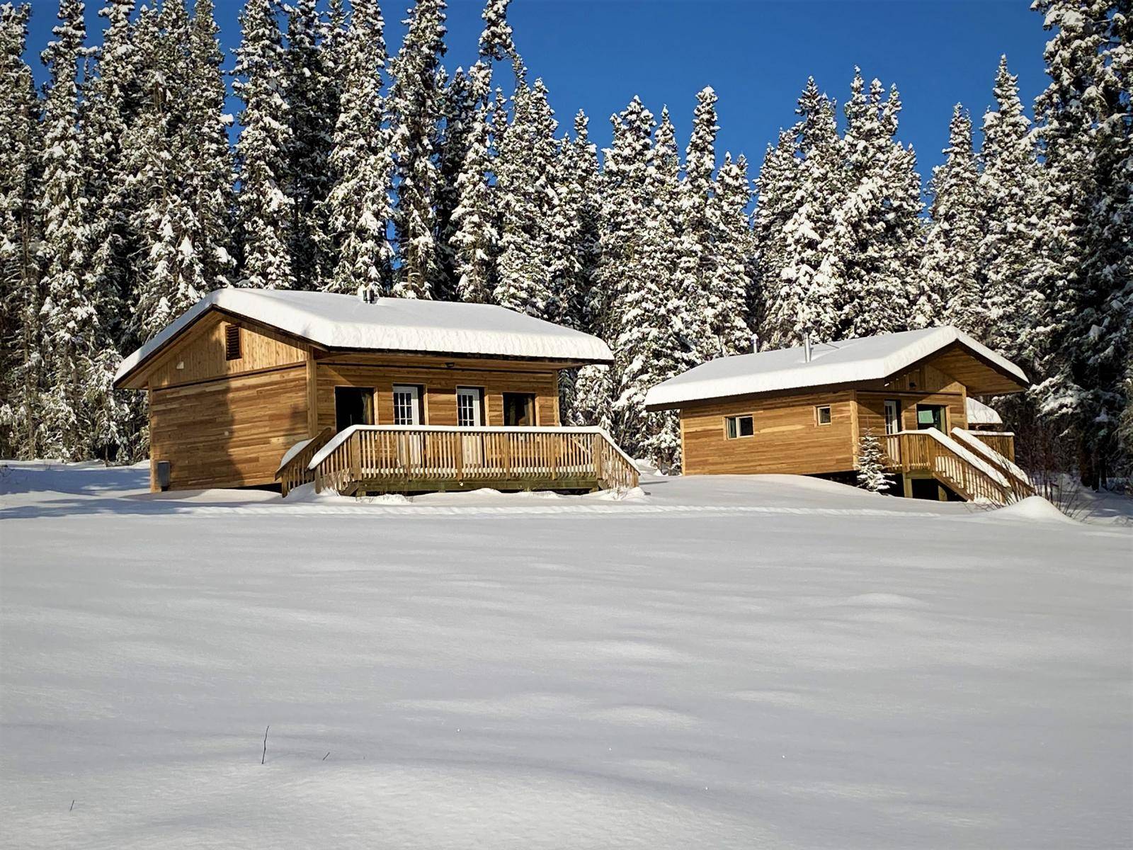 Two cabins in deep snow