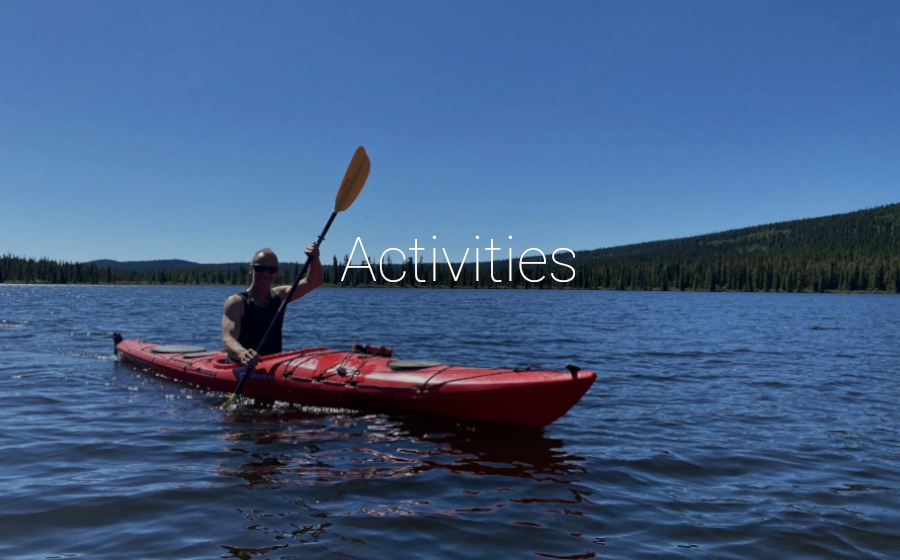 Man on a kayak on a lake with the big text "Activities" overlayed
