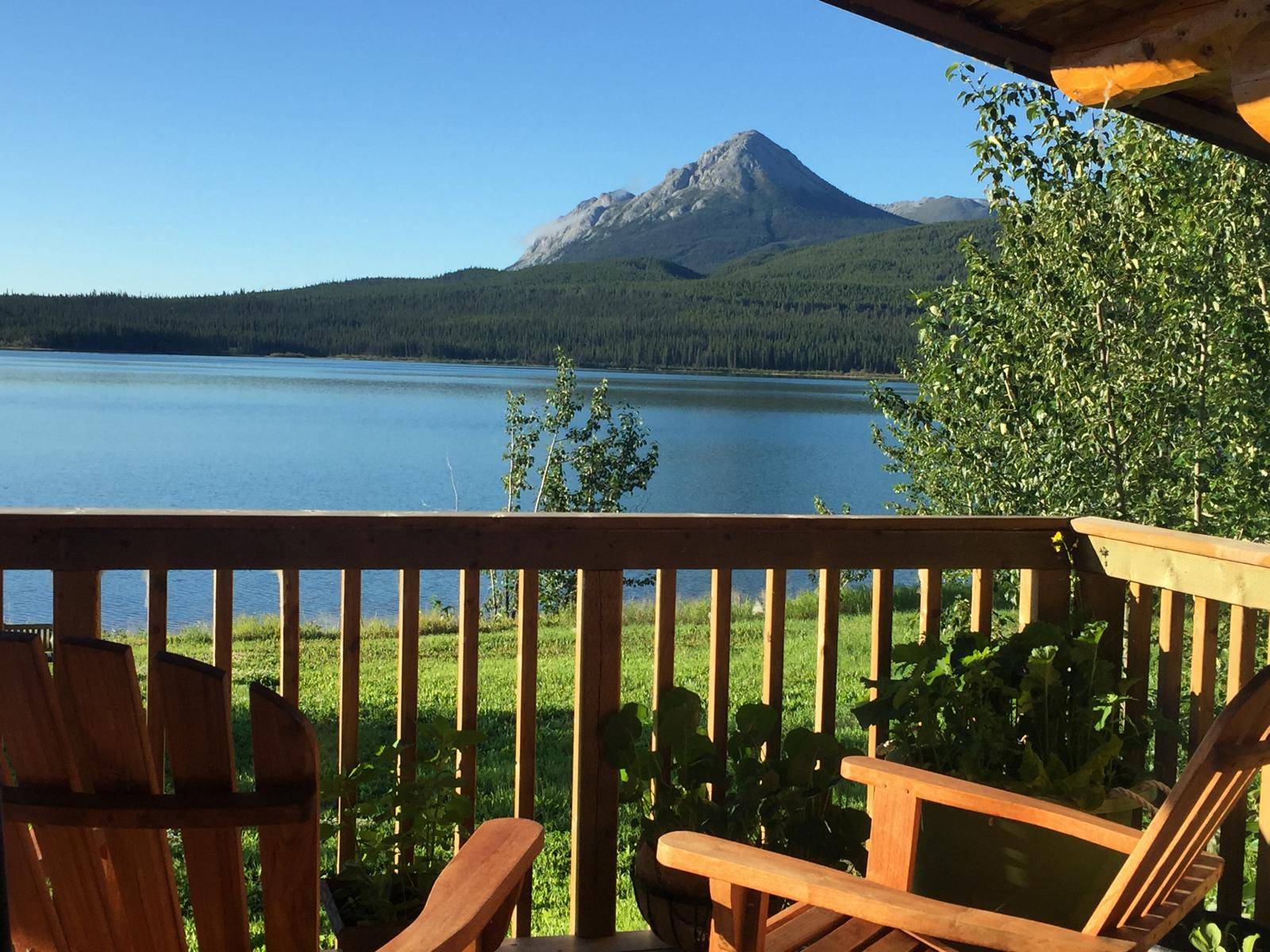 view from cabin terrace to lake and mountains