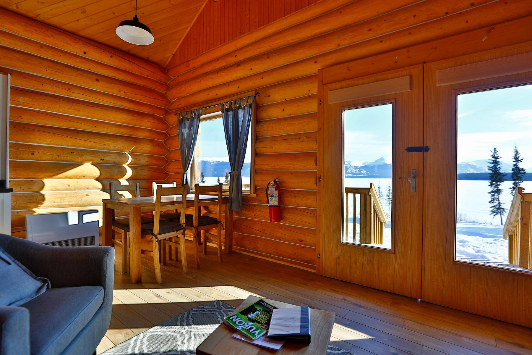 living room in family cabin with view to snow outside
