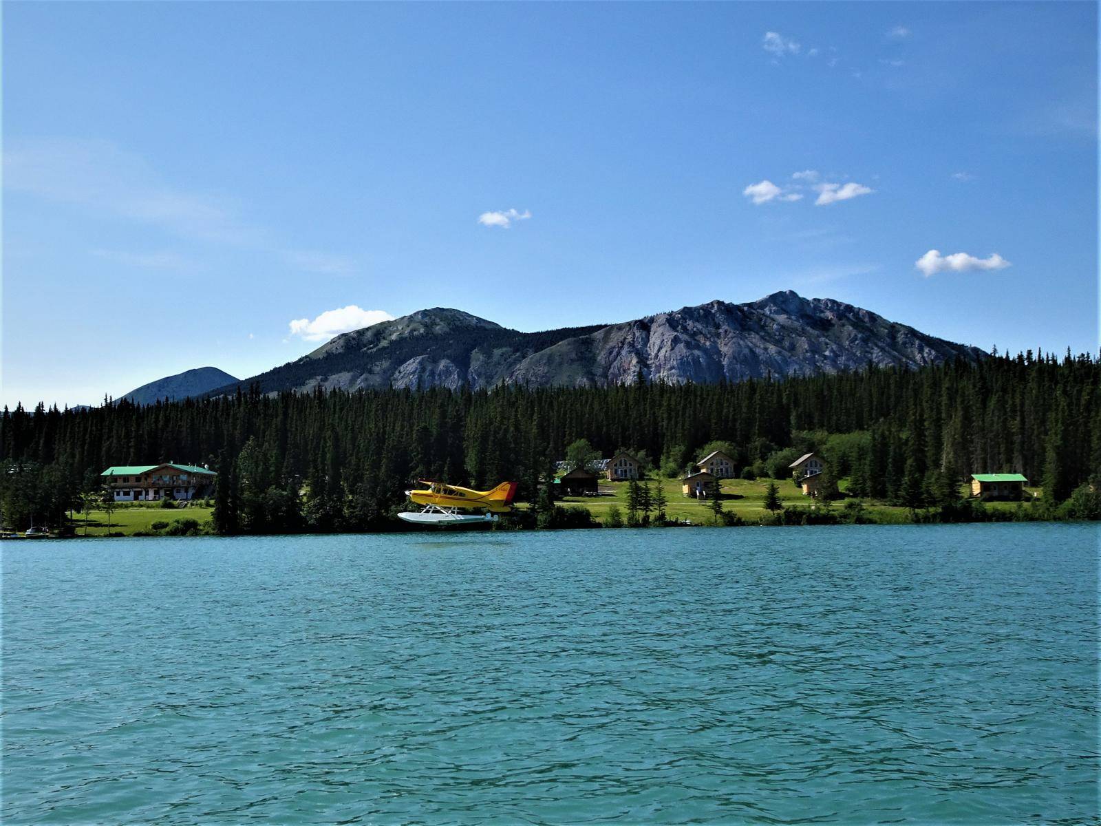 view from lake to resort, floatplane on lake