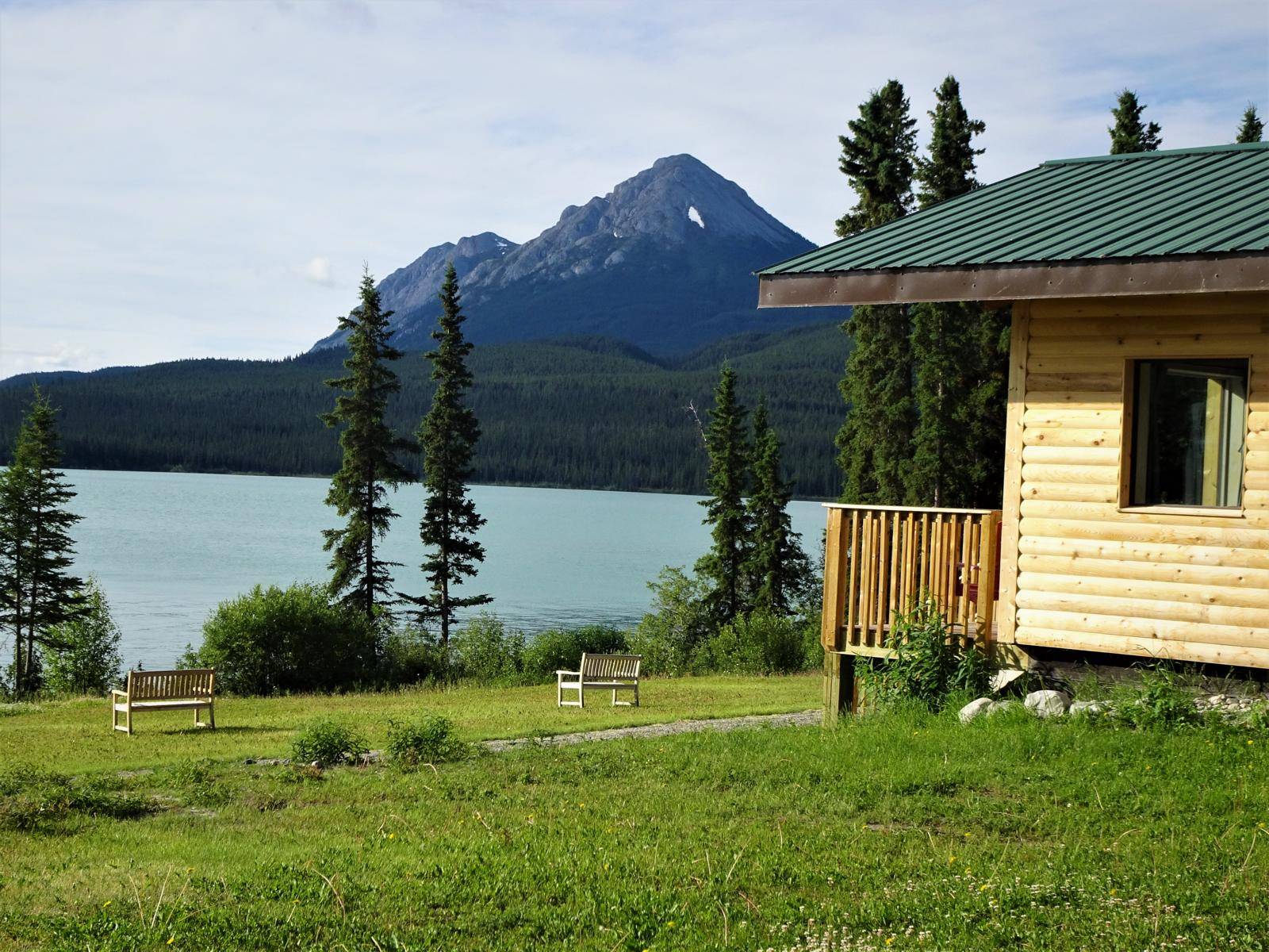 Cabin from side, view on lake and mountains